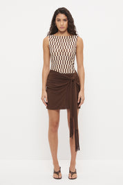 Bodycon mini dress with printed bodice, contrast sarong skirt and macrame tassel tie