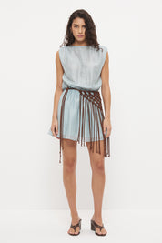 Sleeveless mini dress in sheer woven fabric with blouson bodice and tasseled scarf belt