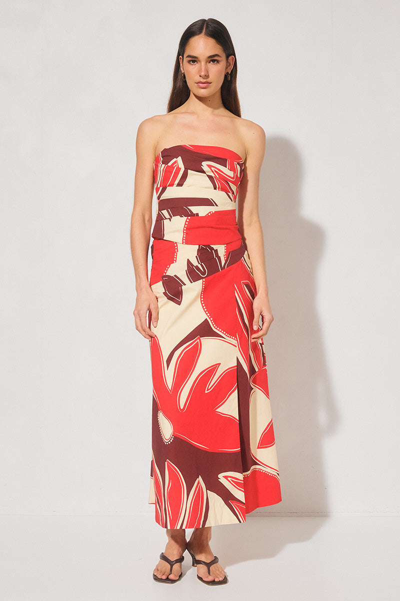 Maxi length cotton blend fit & flare skirt with draped asymmetrical waistband, angled tucks, side front split, and elasticated back panels