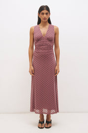 Sleeveless flocked polka dot mesh top with plunging V neckline, empire line seam and ruched fitted silhouette