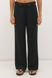 Woman wearing high-rise wide leg pants in a satin-backed linen blend with a tie-up belt featuring bead and ring detail.