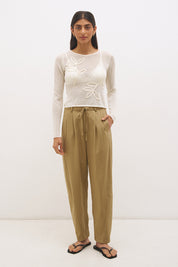 Semi sheer knitted long sleeve top with floral appliqué, jewel neckline and skimming fit