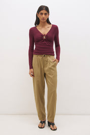 Long sleeve jersey top with plunging V neckline, spiral ring detail and ruched front in a skimming fit