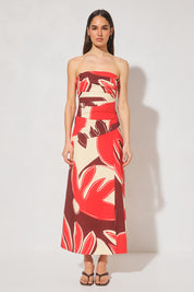 Strapless cotton blend bustier top with straight neckline, angled torso tucks, encased boning, elasticated back panels, and open-ended zipper