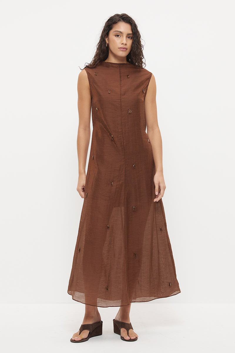 Sheer maxi dress with dropbeading embellishment and jewel neckline over separate slip