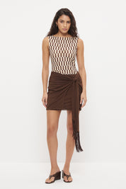 Bodycon mini dress with printed bodice, contrast sarong skirt and macrame tassel tie