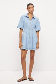 Light wash denim shirt mini dress with fit and flare silhouette, inverted pleats and contrast topstitching