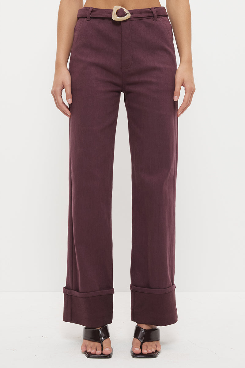 Mid-rise straight leg denim jeans with wide cuff hem and contrast buckle belt