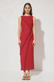 Sleeveless midi dress in textured jersey with skimming column silhouette, boat neckline, waist gathering, contrast frill panel detailing, and side seam split