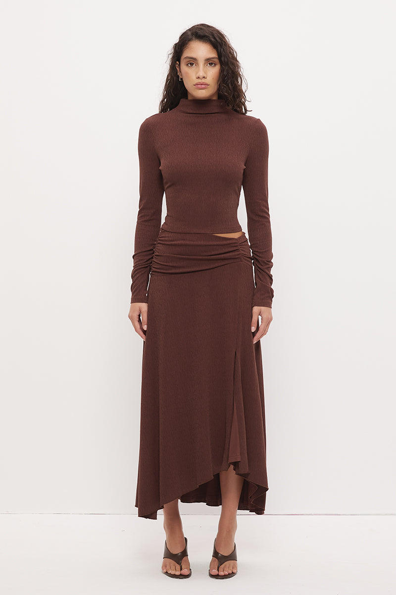 Printed asymmetrical midi skirt with gathered waistband, draped hi-lo hem, and front split in stretch modal jersey