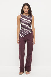 Sleeveless longline top with asymmetrical hemline, boat neckline and cascading waist ruching in exclusive handcrafted print