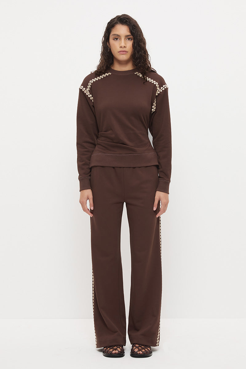 Embroidered fleeced-back sweatshirt with crew neckline, dropped shoulders, waist tucks, and ribbed hem band