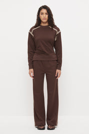 Embroidered fleeced-back sweatshirt with crew neckline, dropped shoulders, waist tucks, and ribbed hem band