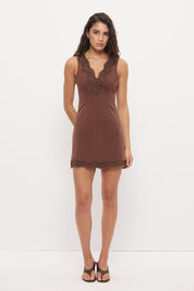 Sleeveless denim mini dress with V-neckline and scallop lace trim detail