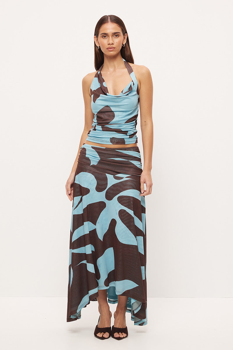 Mid-rise circle cut midi skirt in stretch mesh with asymmetrical gathered waistband and hi-lo hem in exclusive handcrafted print