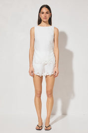 High-waisted tailored shorts with scalloped embroidery, front slant pockets, elasticated back waist, and front zipper closure
