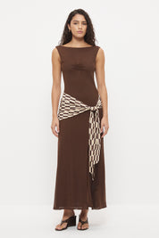 Sleeveless maxi dress with boat neckline, contrast printed sash and macrame tassel detail