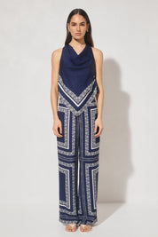 Sleeveless bias top with handcrafted placement print, cowled neckline, handkerchief hemline, and centre-back keyhole