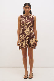 Sleeveless mesh mini dress with handcrafted print, boat neckline, fit and flare silhouette, and hi-lo hem