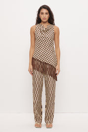 Mid-rise relaxed fit straight leg pants in brushed woven fabric with exclusive handcrafted print