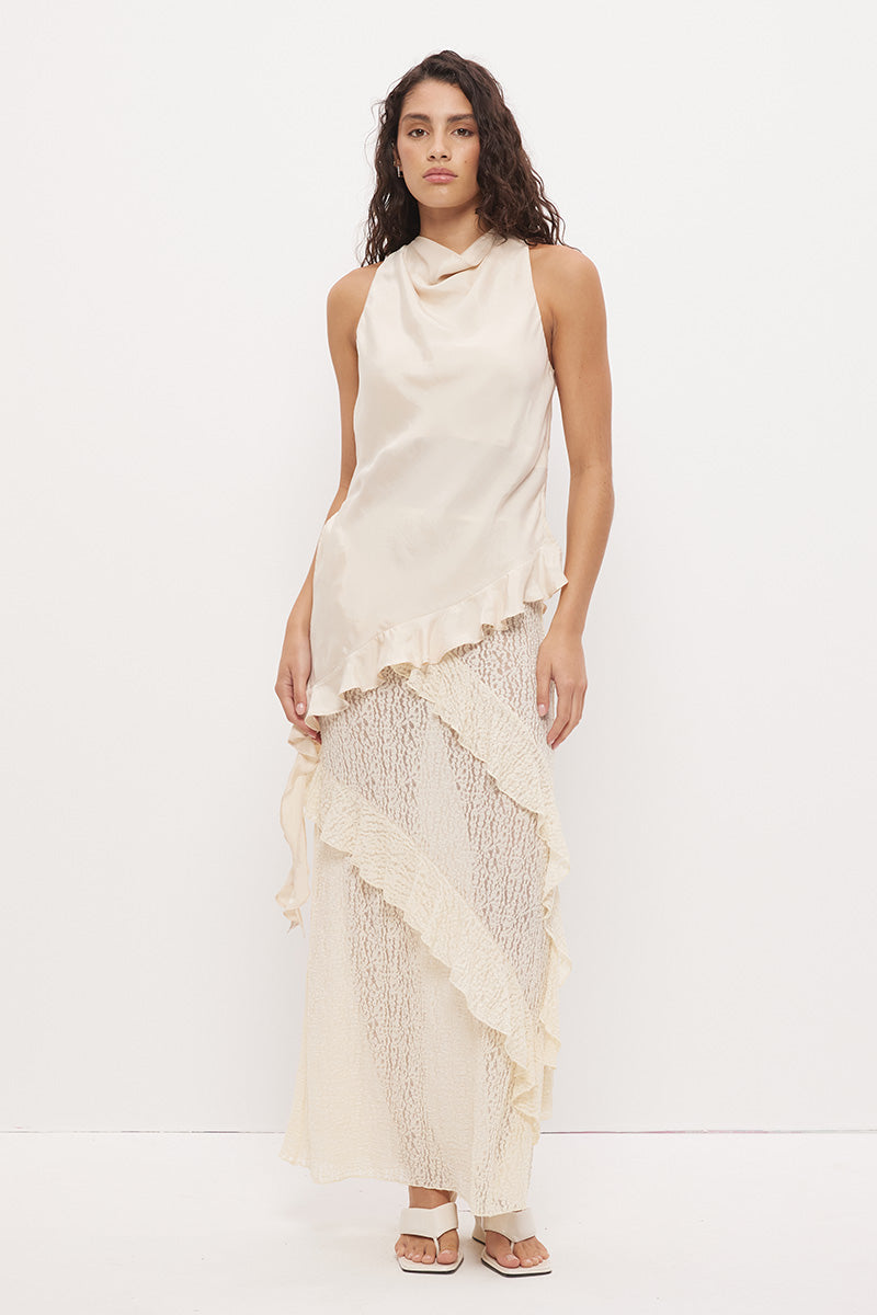 Sleeveless longline top in brushed cupro satin with narrow cowl neckline and asymmetric spiral flounce hem