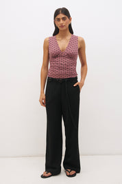 Rosewood and black sleeveless flocked polka dot mesh midi dress with plunging V-neckline, empire seam and A-line skirt