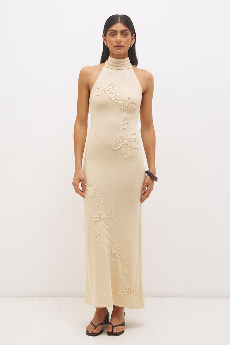 Knitted halter neck maxi dress with floral appliqué, turtleneck band, bodycon bodice and fit and flare skirt