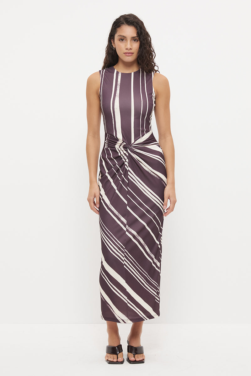 Sleeveless midi dress with fitted column silhouette, twisted knot detail and cascading ruching in exclusive handcrafted print