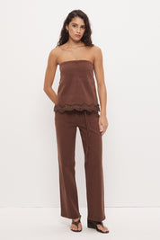 Strapless denim top with A-line silhouette and scallop lace trim hemline