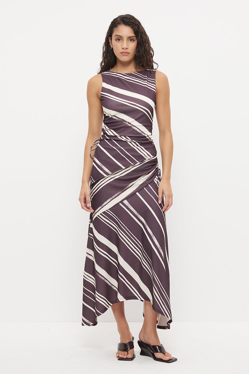Mid-rise midi skirt with deep asymmetrical waist yoke, drawcord ruching and draped hi-lo hem in exclusive handcrafted print