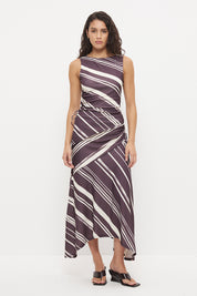 Mid-rise midi skirt with deep asymmetrical waist yoke, drawcord ruching and draped hi-lo hem in exclusive handcrafted print
