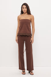 Mid-rise straight leg denim jeans with narrow waist tie and rivet detailing