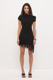 Off-shoulder mini dress in stretch knit crepe with asymmetrical neckline and angled fringe hem detail