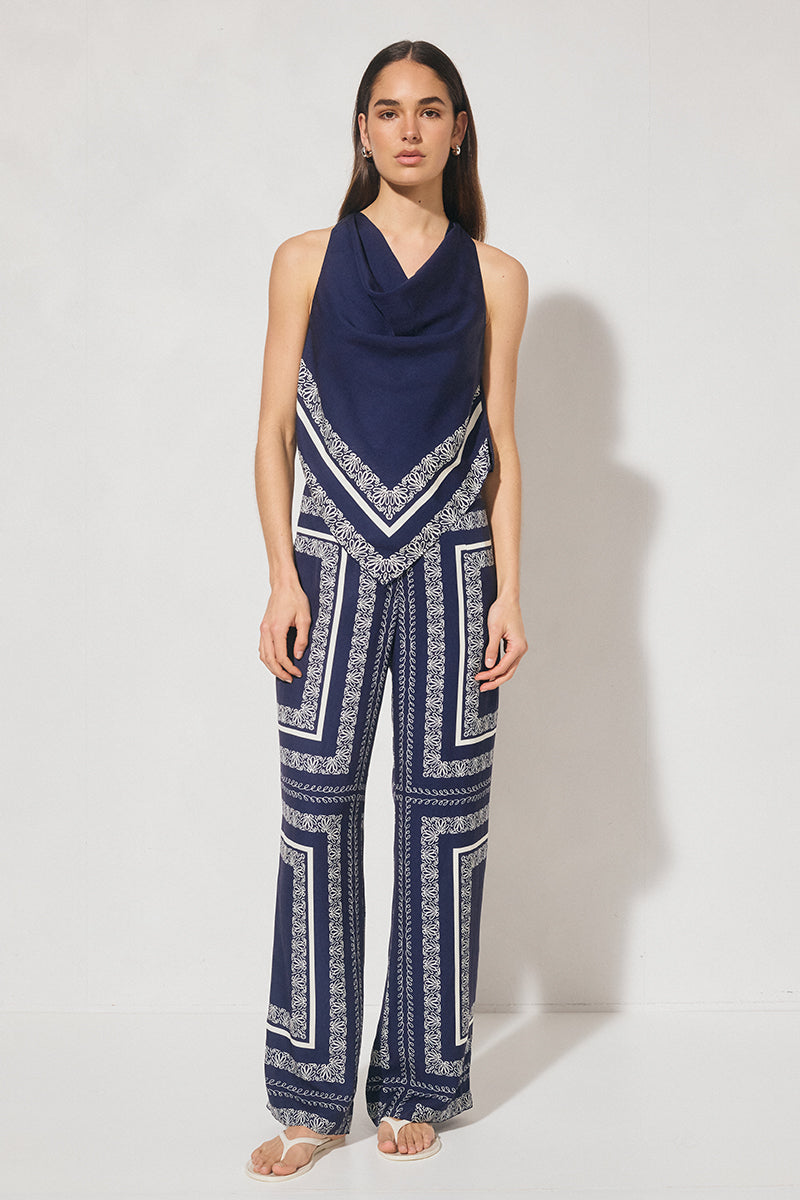 High-waisted tailored woven pants with handcrafted print, straight-leg silhouette, narrow waistband, and side seam pockets