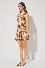 Sleeveless mesh mini dress with handcrafted print, boat neckline, fit and flare silhouette, and hi-lo hem