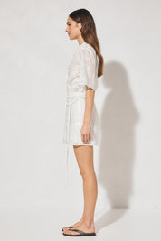 Semi-sheer embroidered mini shirt dress with V-neck notch collar, short sleeves, A-line skirt, and removable macramé waist belt