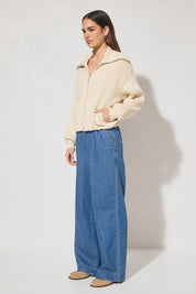 Chunky rib knit bomber jacket with wide dropped shoulders, balloon sleeves, ribbed collar and cuffs, bubble hem with internal elastic, welt pockets, and 2-way metal zipper