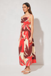 Handcrafted print strappy maxi dress with ruched bodice, dropped waist, gathered skirt, adjustable straps, and apron neckline