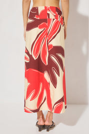Maxi length cotton blend fit & flare skirt with draped asymmetrical waistband, angled tucks, side front split, and elasticated back panels