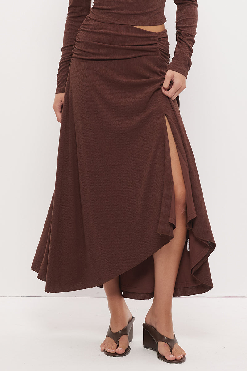 Printed asymmetrical midi skirt with gathered waistband, draped hi-lo hem, and front split in stretch modal jersey