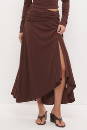 Printed asymmetrical midi skirt with gathered waistband, draped hi-lo hem, and front split in stretch modal jersey