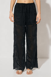 ELOWEN Relaxed Drawstring Pants in semi-sheer embroidered fabric with wide-leg silhouette, elasticated waist, drawcord, and side pockets