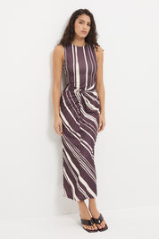 Sleeveless midi dress with fitted column silhouette, twisted knot detail and cascading ruching in exclusive handcrafted print