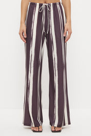 Mid-rise relaxed fit straight leg pants with drawcord waist in exclusive handcrafted print