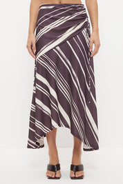 Mid-rise midi skirt with deep asymmetrical waist yoke, drawcord ruching and draped hi-lo hem in exclusive handcrafted print