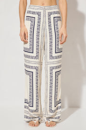 High-waisted tailored woven pants with handcrafted print, straight-leg silhouette, narrow waistband, and side seam pockets