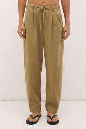 Cotton twill barrel leg pants with mid-rise fit, drawstring waist and structured panel detailing