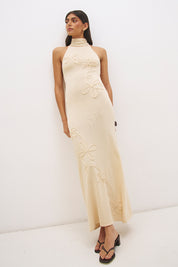Knitted halter neck maxi dress with floral appliqué, turtleneck band, bodycon bodice and fit and flare skirt
