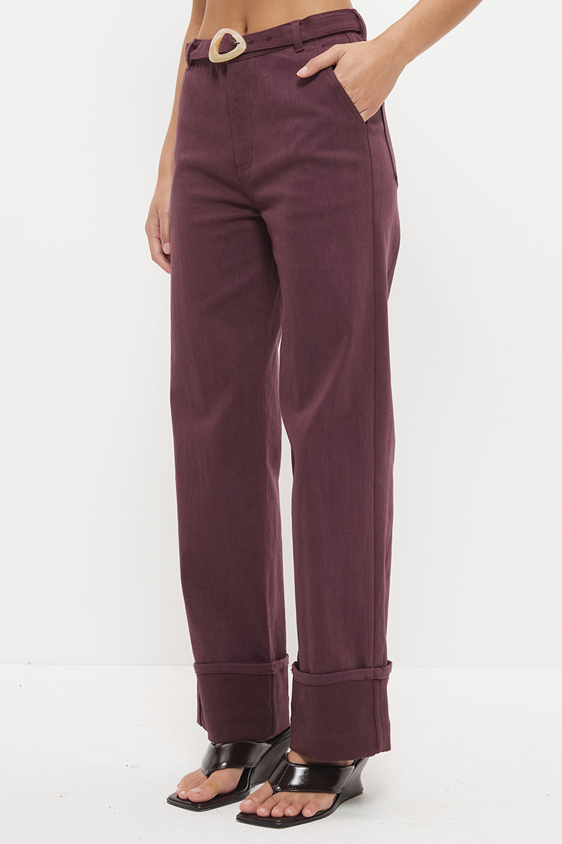 Mid-rise straight leg denim jeans with wide cuff hem and contrast buckle belt