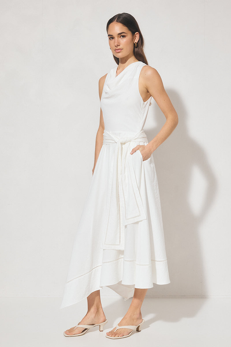 Sleeveless textured woven fit and flare midi dress with cowled neckline, ladder trim hem, handkerchief skirt, and waist sash